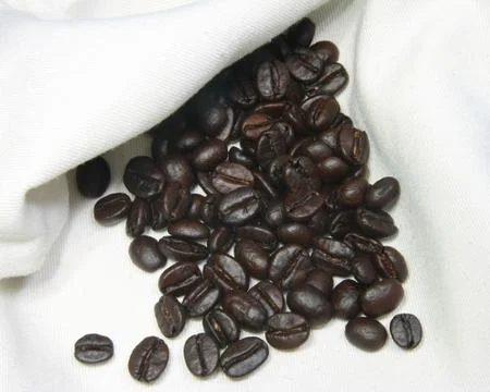 Coffee beans on hemp bag Stock Photos