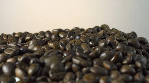 Coffee Beans isolated rotating on beige/gray background Stock Footage 62381759