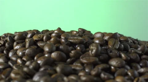 Coffee Beans isolated rotating on green/gray background Stock Footage 62381271