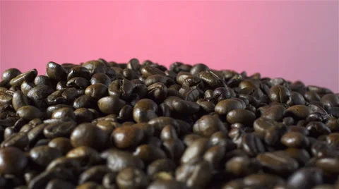 Coffee Beans isolated rotating on red/gray background Stock Footage 62380059
