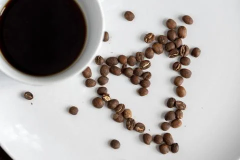 Coffee beans. Isolated on a white background closeup Stock Photos