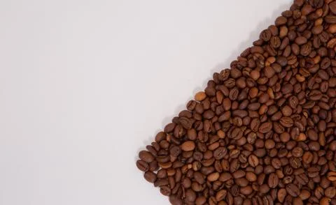 Coffee beans isolated on a white background with copyspace for text. Stock Photos