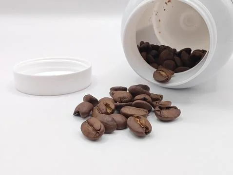Coffee beans in a jar close up Stock Photos