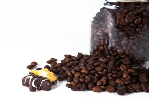 Coffee beans in a jar on old kitchen table. Stock Photos