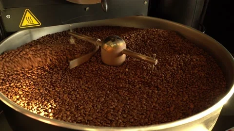 Coffee beans on a large cooling plate of a roasting machine Stock Footage 234627330