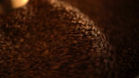 Coffee beans on a large cooling plate of a roasting machine Stock Footage 234628574