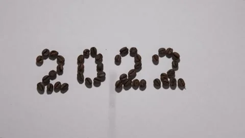 Coffee beans lie in the shape of the number 2022 Video stock 162786486