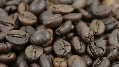 Coffee beans. Loop rotation. Front of the camera rotates plate with coffee beans Stock Footage 70346854