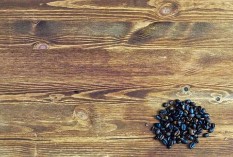 Coffee beans lying on the kitchen counter Stock Photos