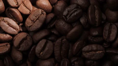 Coffee beans. Macro shot of sunbeam moves from right to left showing awesome Stock-Footage 207910146
