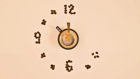 Coffee beans making clock. Coffee time concept. Creative stop motion. Flat lay 動画素材 232151796