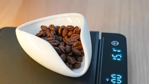 Coffee Beans Measured on Digital Scale Stock Photos