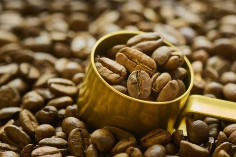 Coffee beans in a measuring spoon close up Stock Photos
