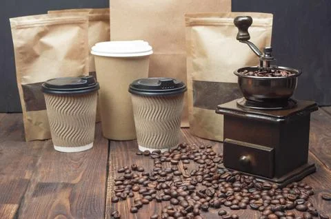 Coffee beans, mill, ground coffee on wooden table. Copyspace. Making coffee Stock Photos