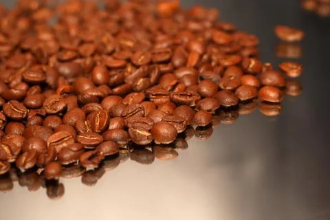Coffee beans on mirror Stock Photos