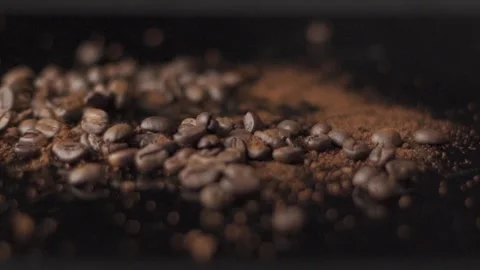 Coffee beans in motion on black background Stock Footage 278729620