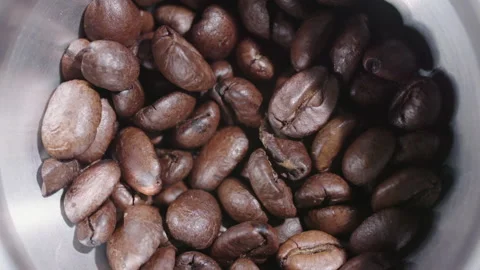 Coffee beans moving in grinder 1 Stock Footage 130574627