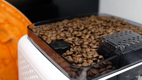 Coffee Beans Moving Inside Grinder Hopper as Espresso Machine Pulls Them In Stock Footage 274895410