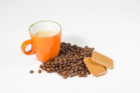 Coffee beans with mug &amp; biscuits Stock Photos