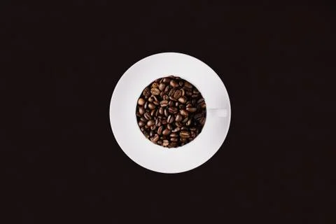 Coffee beans in a mug Stock Photos