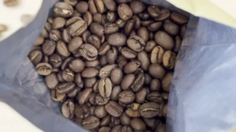 Coffee beans in open packaging approximation Stock Footage 300090029