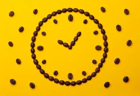 Coffee beans on an orange background. Stock Photos