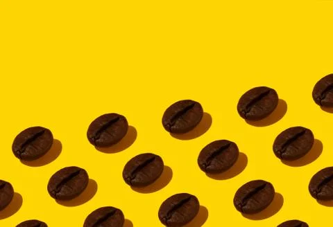 Coffee beans on an orange background. Stock Photos