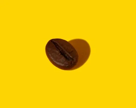 Coffee beans on an orange background. Stock Photos