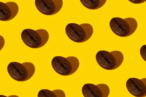 Coffee beans on an orange background. Stock Photos