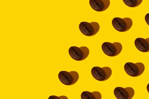 Coffee beans on an orange background. Stock Photos