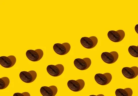 Coffee beans on an orange background. Stock Photos