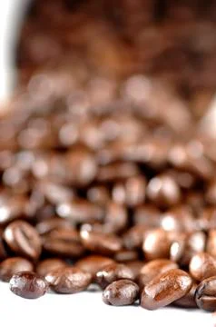 Coffee beans outside the cup Stock Photos