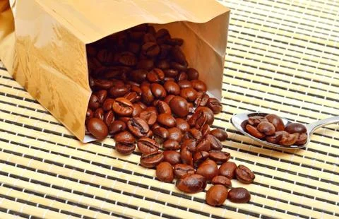 Coffee beans on the package on the tablecloth Stock Photos