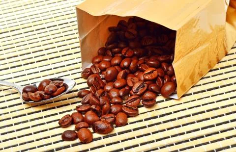 Coffee beans on the package on tablecloth Stock Photos
