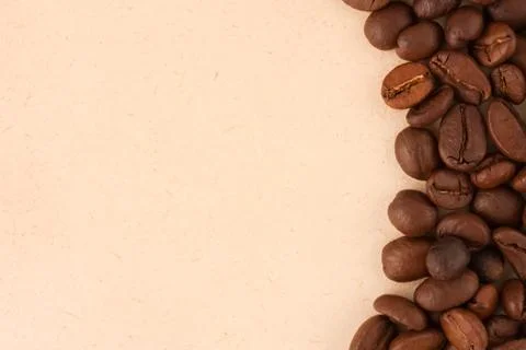 Coffee beans on paper background Stock Photos