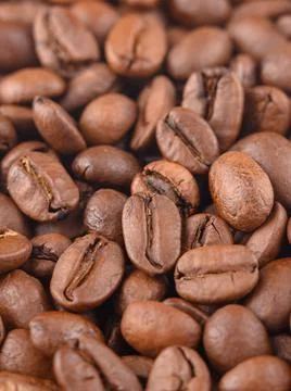 Coffee beans pattern macro. Photo vertical espresso aroma caffeine Stock Photos