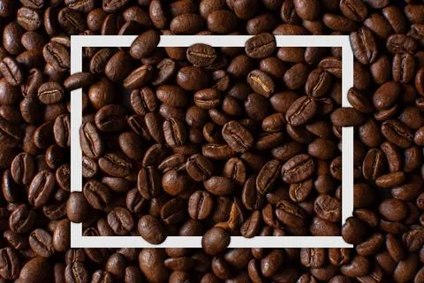 Coffee beans pattern with white frame Stock Photos