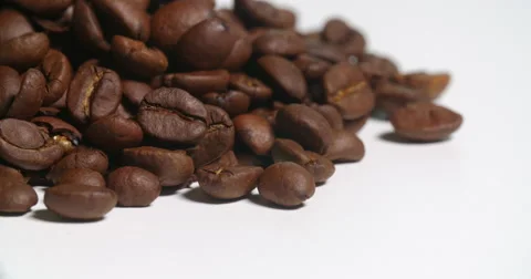 Coffee Beans Pile Close Up Edge on White Spins Stock Footage 64974506