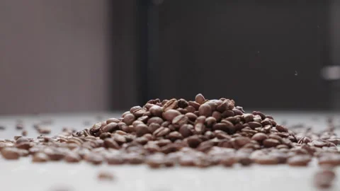 Coffee Beans Pile with Floating Coffee Particles in Air Stock Footage 330539328