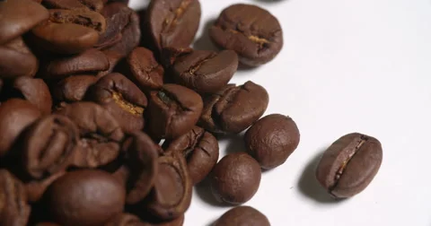 Coffee Beans Pile Macro Edge on White Spins Stock Footage 64974612