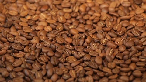 Coffee beans, a pile of roasted coffee beans rotating. Close up Stock Footage 75826674