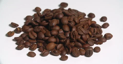 Coffee Beans Pile Uncooked Spinning on White Stock Footage 64974585