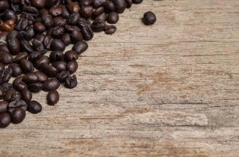 Coffee beans on plank Stock Photos