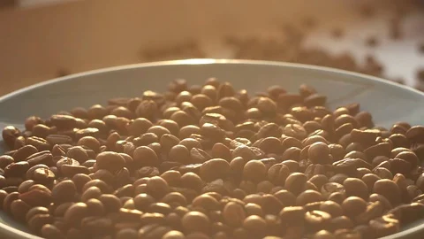Coffee beans on a plate rotation, sun in the morning Stock Footage 89864202