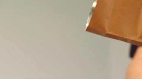 Coffee Beans Pour from a Brown Bag - Profile Shot Stock Footage 61404229