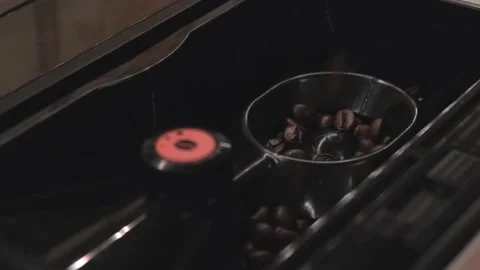Coffee beans poured into the coffee machine for grinding Stock Footage 135183427