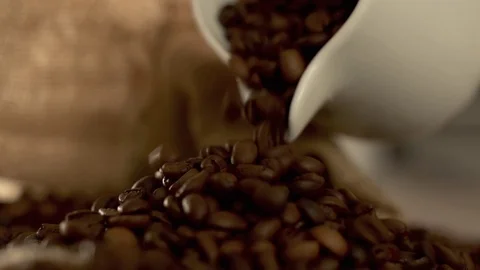 Coffee beans poured out in slow motion Stock Footage 76050960