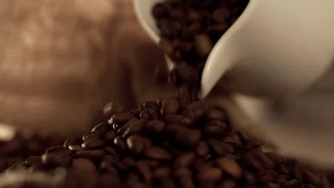 Coffee beans poured out in slow motion Stock Footage 76050979