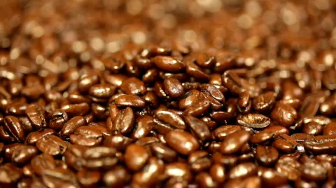Coffee beans poured into pile Stock Footage 311688