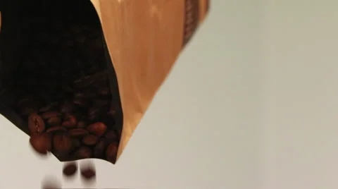 Coffee Beans pouring from a Brown Bag Stock Footage 61404566